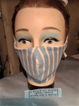 A Personal Care Boutique Face Mask cotton handsewn in California preppy blue with stripes of yellow and white